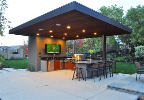Backyard kitchen - Keep views open and get creative with privacy walls, if needed. This outdoor kitchen has an open design so that when you’re cooking, you’re still in the middle of the action and view. 2 ...